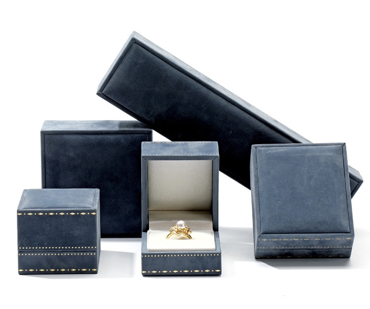 Jewelry packaging for multiple jewels fabric wrapped stamping pattern